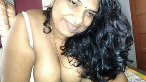 Tamil auntie gives a blowjob in a steamy video