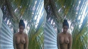 A stunning Sri Lankan woman displays her naked body and bathes in the open air