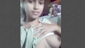 A young Desi girl flaunts her big breasts and intimate area in solo video