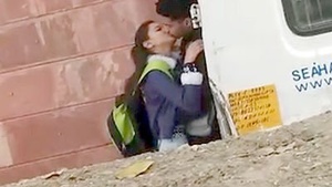 Teen college students share a passionate kiss