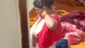 Mature Indian woman caught on hidden camera while undressing