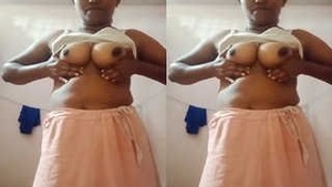 Desi wife flaunts her curves and bathes in front of camera