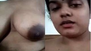 Budi's big boobs get a sensual massage in this steamy video