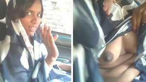 Masturbating Indian babe in the car with big tits and cock sucking