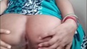 Indian mom flaunts her ample buttocks and pleasures herself with her hands