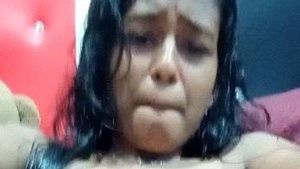 Tamil babe masturbates and jerks off a teen's hairy pussy in solo video