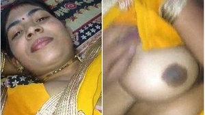 Busty bhabhi's seductive pose with her boobs