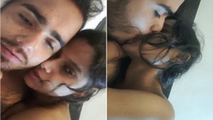 Indian couple enjoys passionate bedroom kissing in softcore video