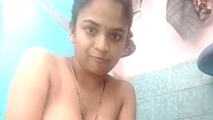 Nude Indian girl indulges in solo play in the bathtub